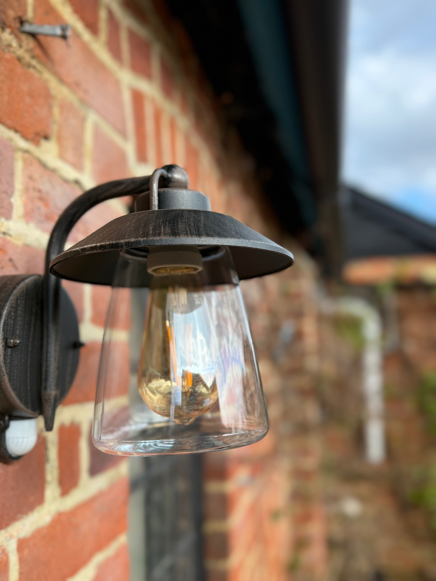 Exterior wall lantern fitted to a brick wall